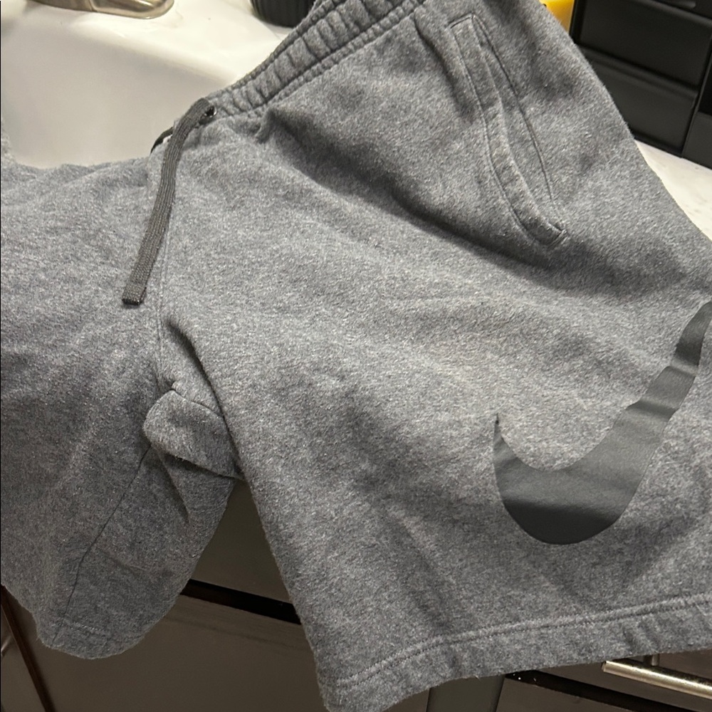 Nike Men's Gray Athletic Shorts with Black Swoosh